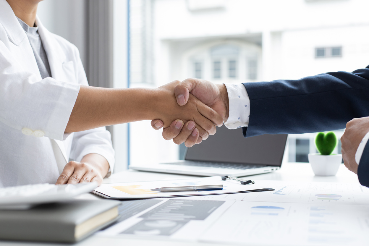 Colleagues Shake Hands after Meeting 